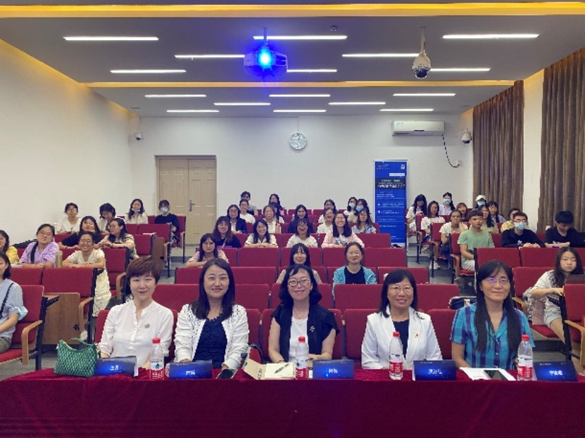 A group of people sitting at a table
Description automatically generated with low confidence